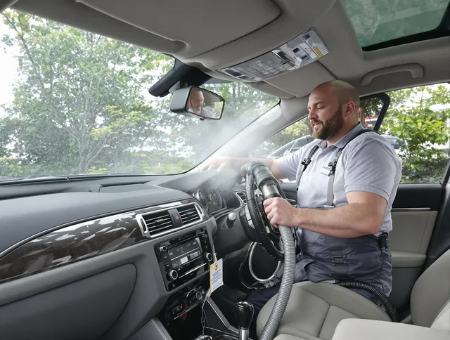 Littleton Air Duct Cleaning specialist performing professional car duct cleaning in Littleton