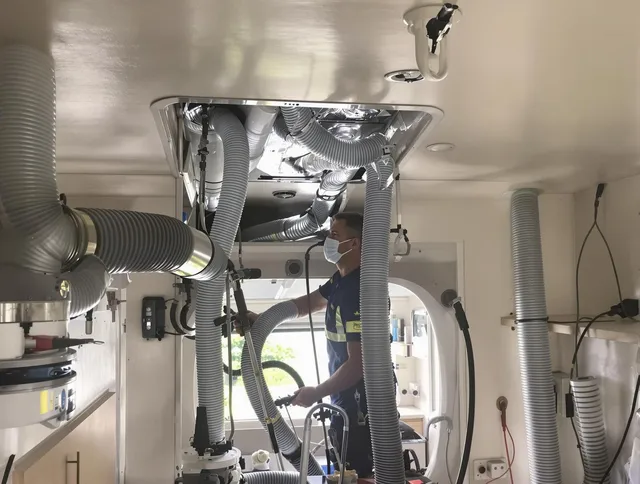Littleton Air Duct Cleaning specialist performing precise mobile home duct cleaning in Littleton