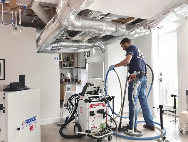 Littleton Air Duct Cleaning technician performing advanced pure duct cleaning with specialized equipment in Littleton
