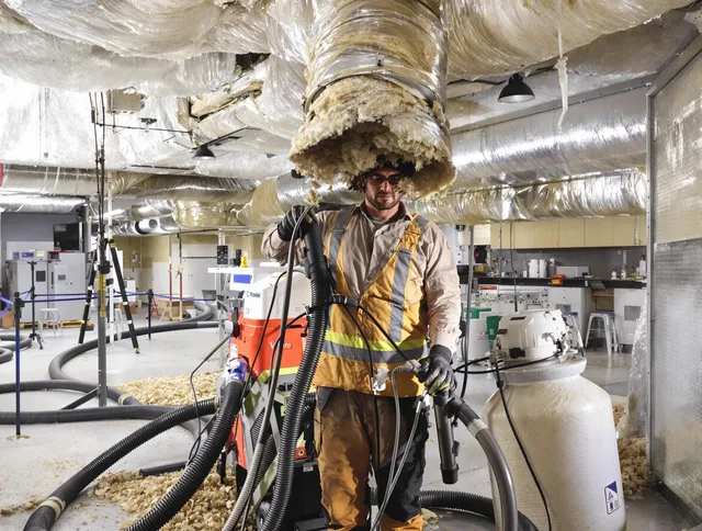 Professional vacuum insulation removal by Littleton Air Duct Cleaning expert in Littleton